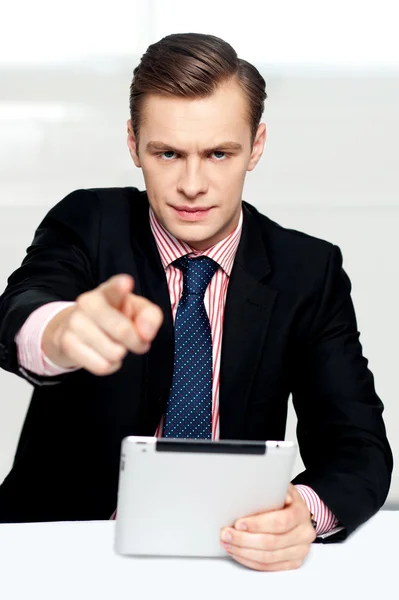 Tech savvy corporate man pointing at you — Stock Photo, Image
