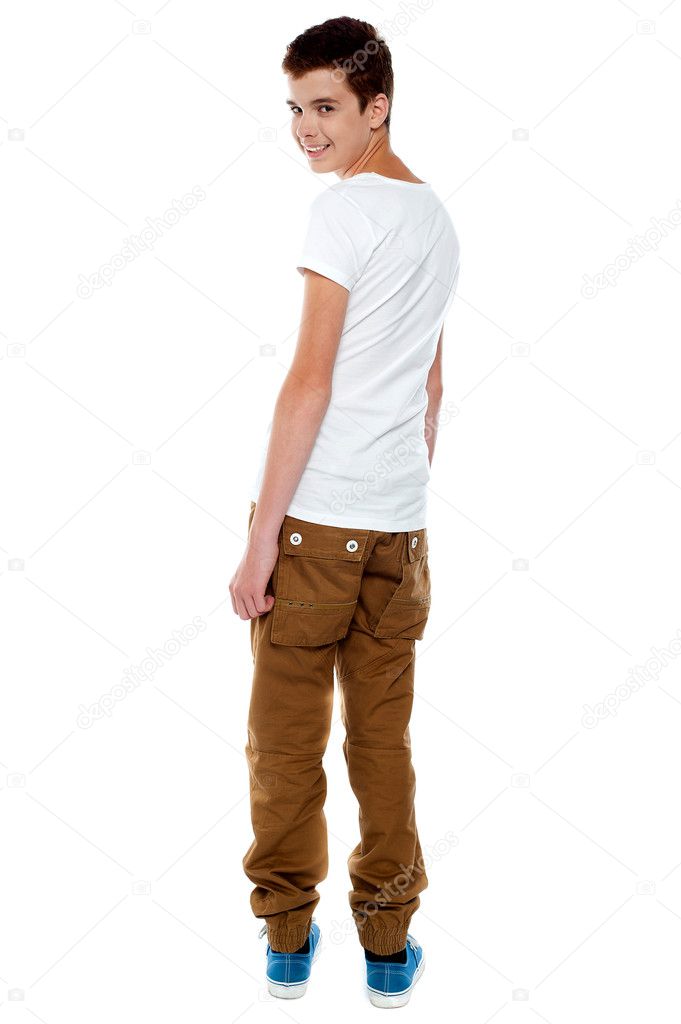Trendy young boy turning back — Stock Photo © stockyimages #11781930