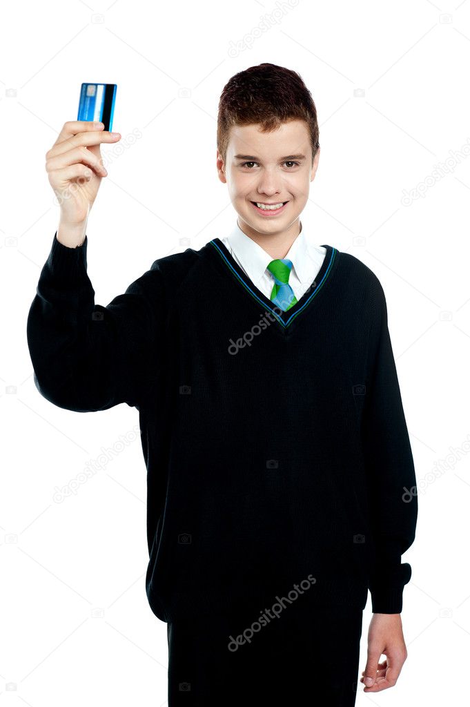 School boy holding credit card
