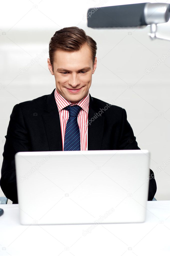 Business male watching videos on laptop