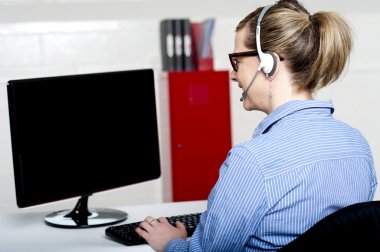 Back view of help desk lady working clipart