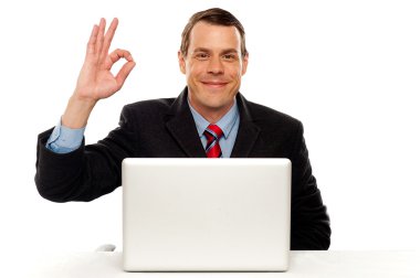 Attractive businessperson showing okay gesture clipart