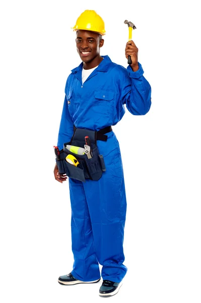 Young african repairman holding hammer — Stock Photo, Image