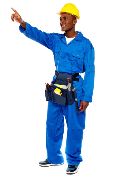 Young african male worker pointing at copy space — Stock Photo, Image