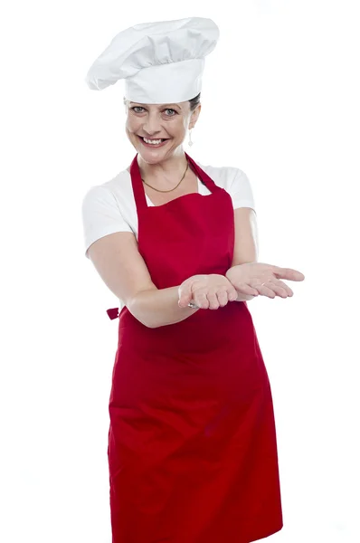 Female chef with open palms — Stock Photo, Image