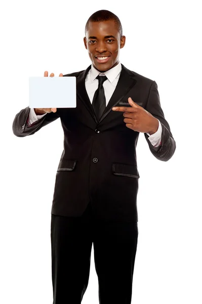 Business promoter pointing at blank placard — Stock Photo, Image
