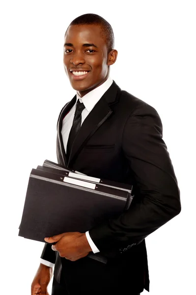 Handsome young executive holding files — Stock Photo, Image