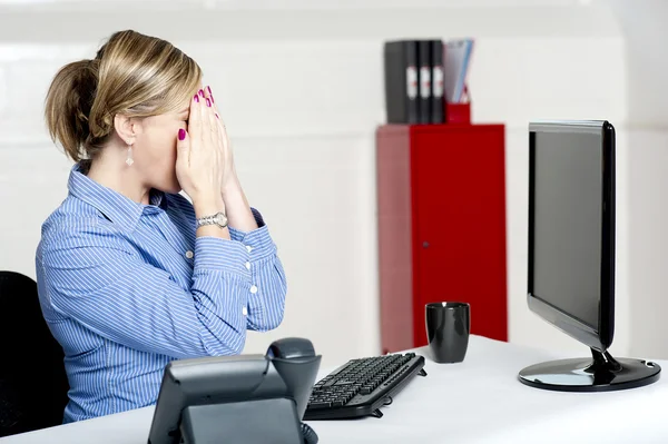Female secretary hiding her face with hands — Stock Photo, Image
