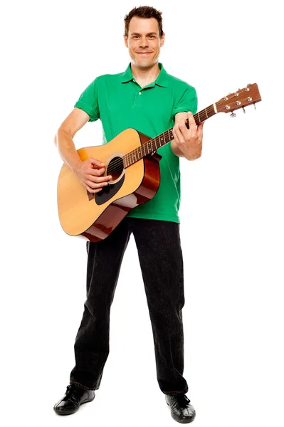 Young caucasian guitarist playing tracks — Stock Photo, Image