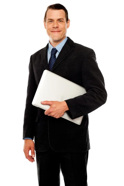 Bello business executive in possesso di laptop — Foto Stock