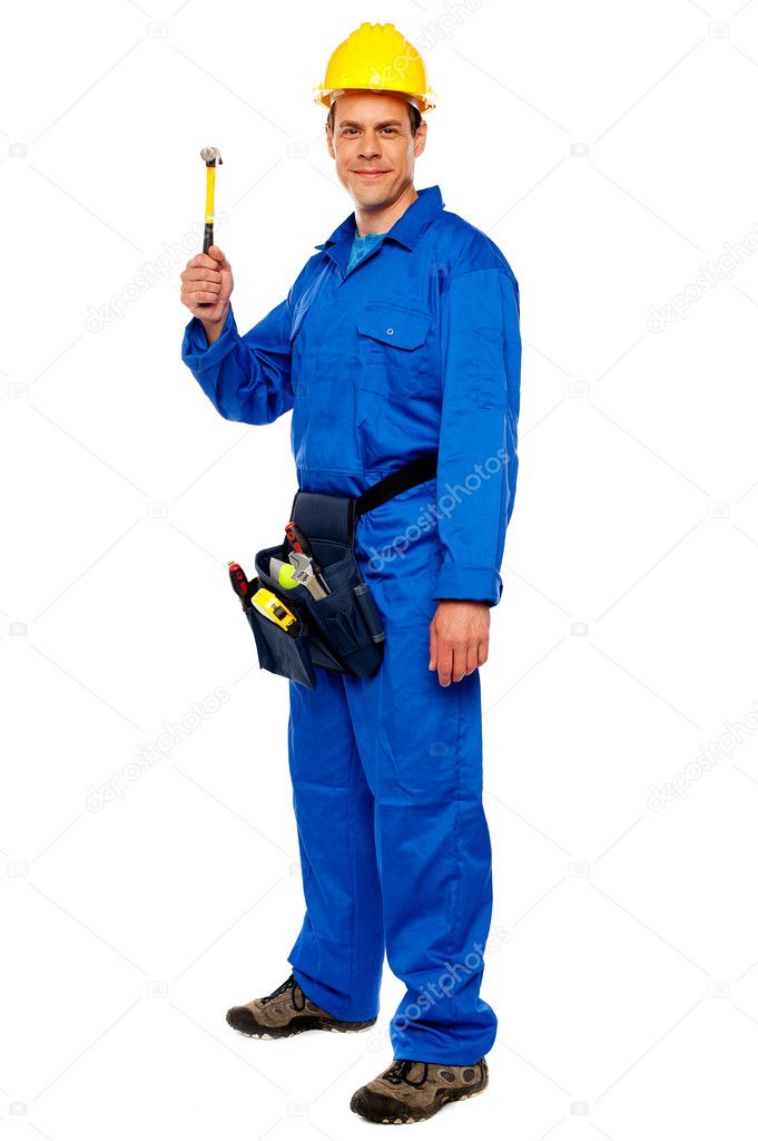 Young construction worker holding hammer