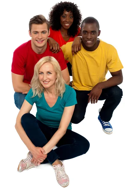 Group of friends sitting on floor — Stock Photo, Image