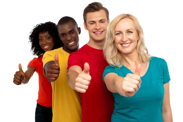 Smiling group of with thumbs up gesture — Stock Photo, Image