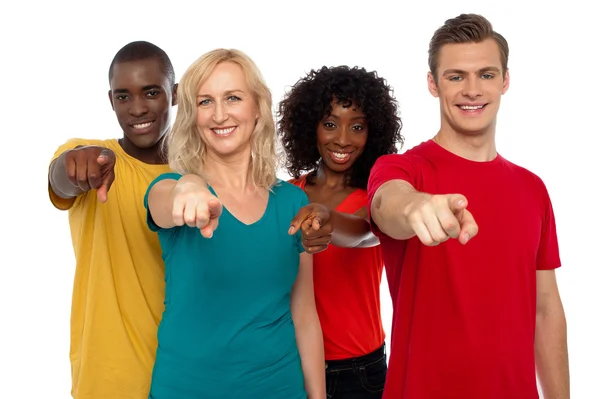 Team of smiling teenagers indicating at you — Stock Photo, Image