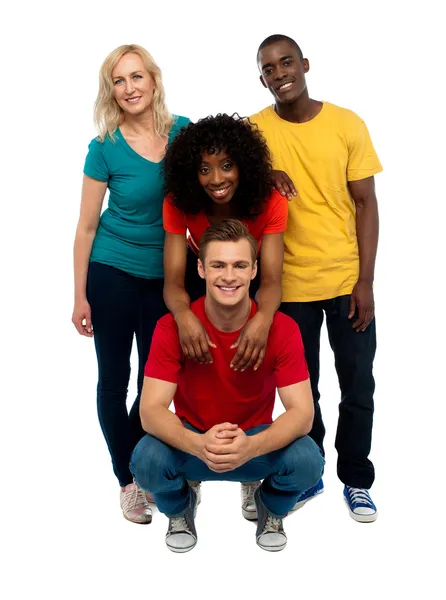 Group of four happy young — Stock Photo, Image