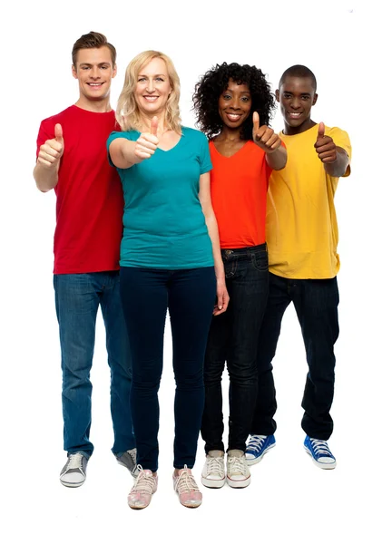 Happy young teens gesturing thumbs up — Stock Photo, Image