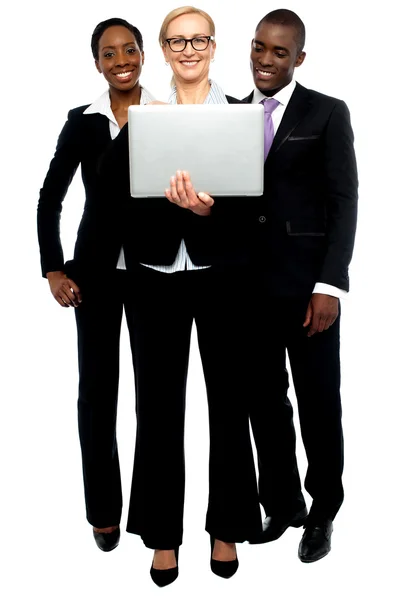 Group of business looking into laptop — Stock Photo, Image