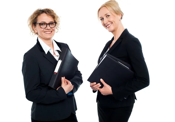 Happy middle aged business females holding files — Stock Photo, Image