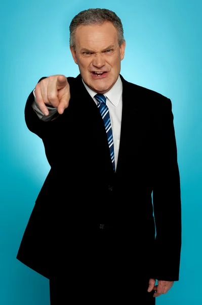 Angry senior businessman pointing finger at you — Stock Photo, Image