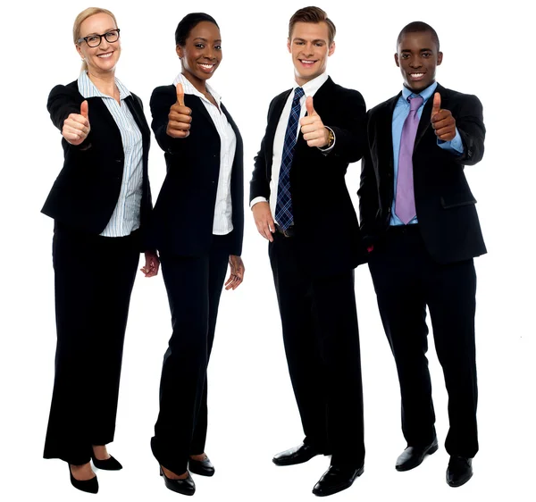 Corporate team gesturing thumbs up — Stock Photo, Image