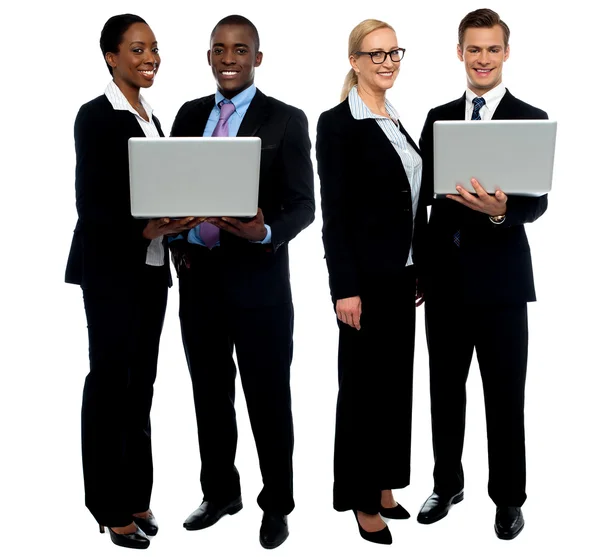Two business teams posing with laptop — Stock Photo, Image