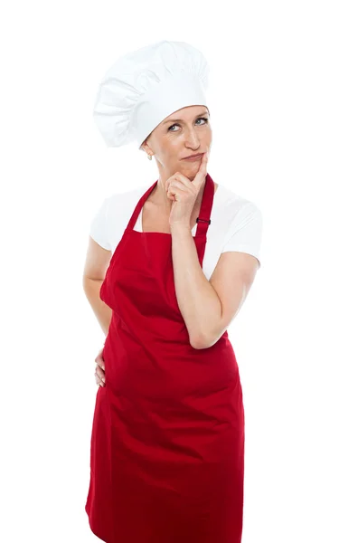 Thoughtful female chef looking away — Stock Photo, Image