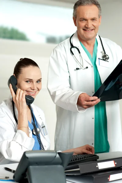 stock image Two experienced medical representatives posing