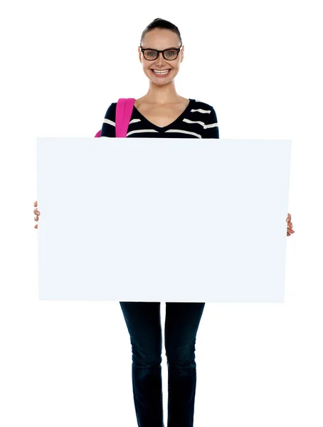 Teenager presenting white blank billboard — Stock Photo, Image
