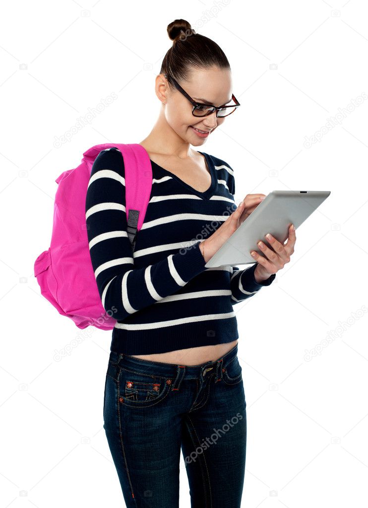 Attractive teenager working on tablet pc