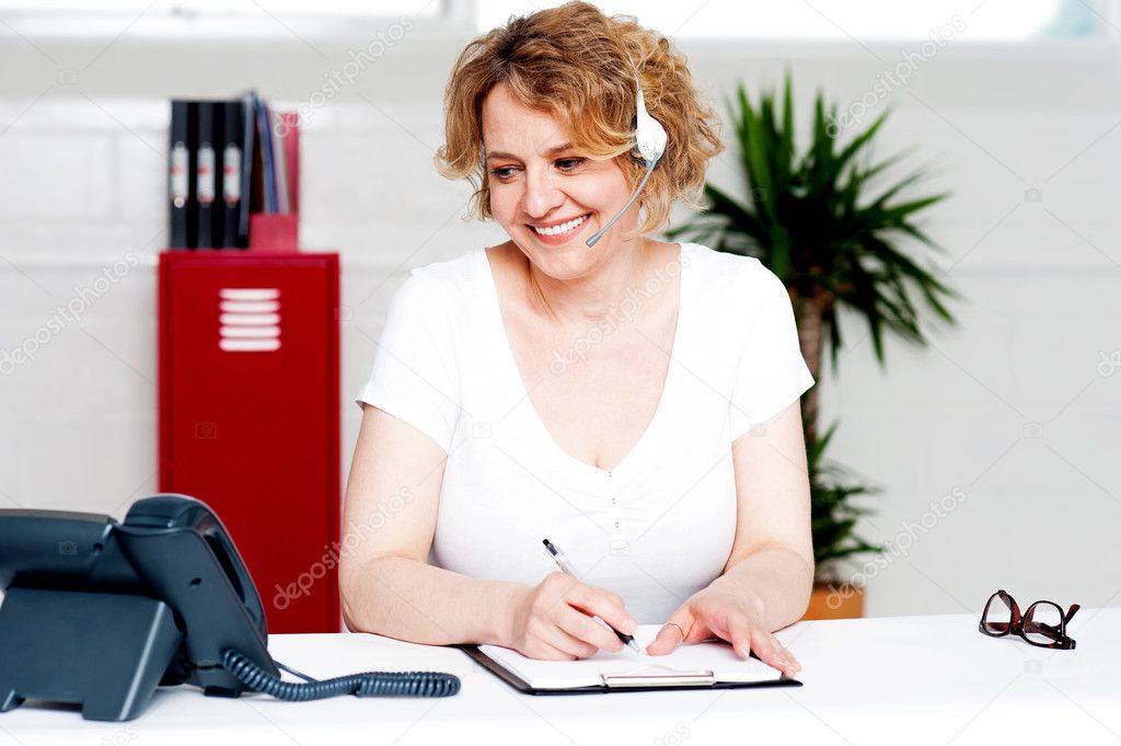 Cheerful customer support executive at work