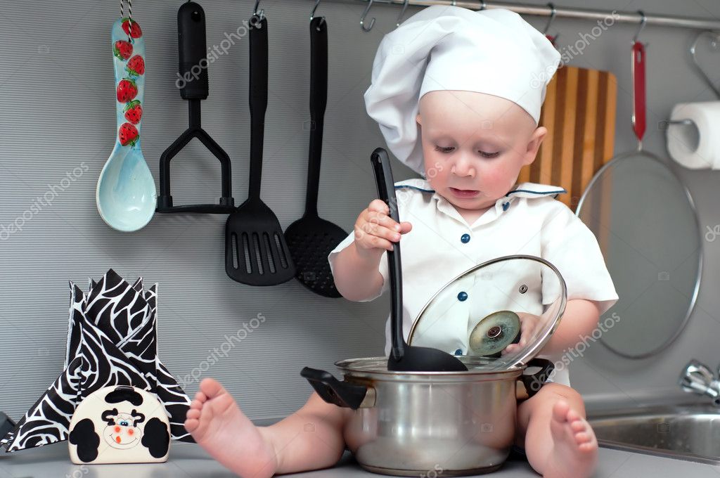 baby with big cooking pot Stock Photo