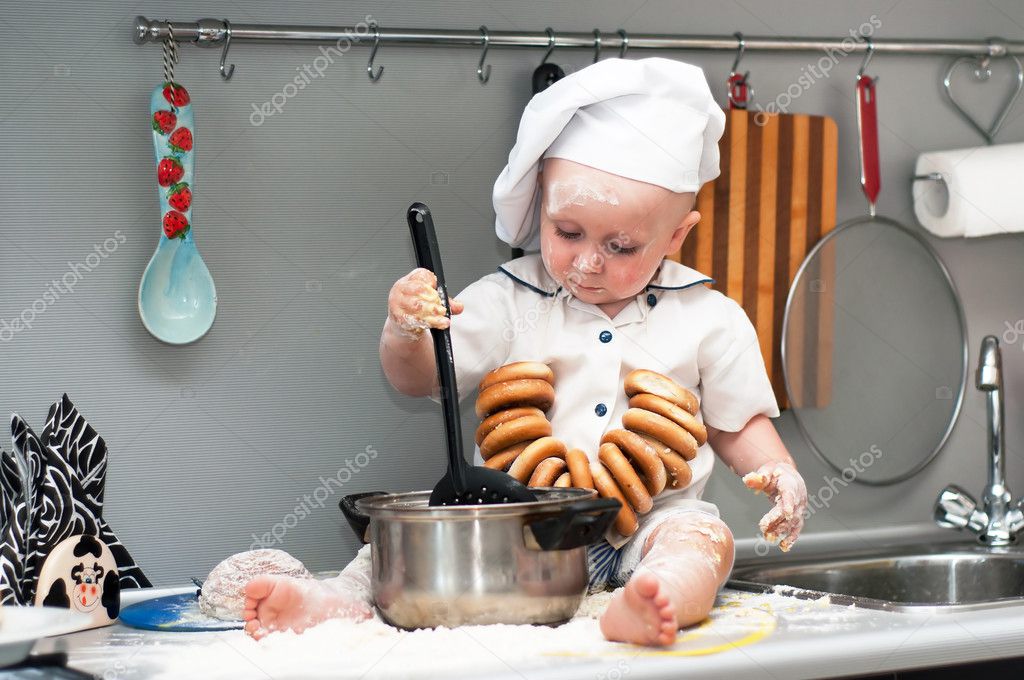 baby with big cooking pot Stock Photo