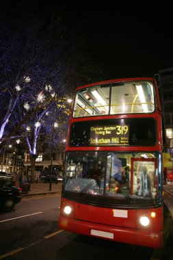 Dobule Decker Bus at Night clipart