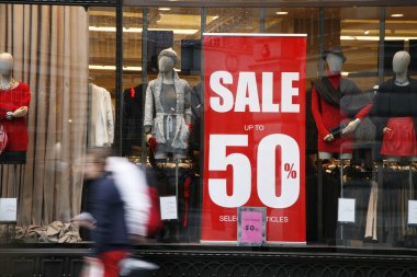 Sale signs in shop window clipart