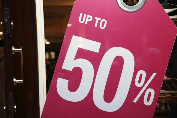 Sale signs in shop window — Stock Photo, Image