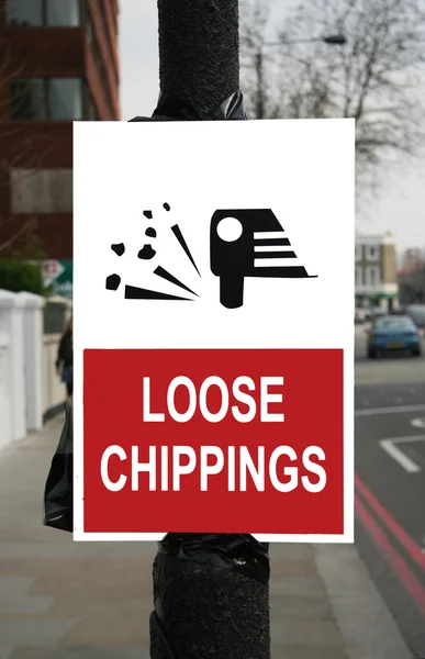 Chippings sueltos signo de poste — Foto de Stock