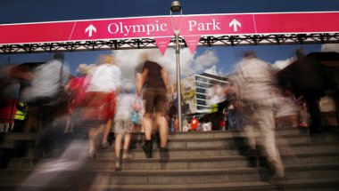 Spectators walking into Olympic Park clipart