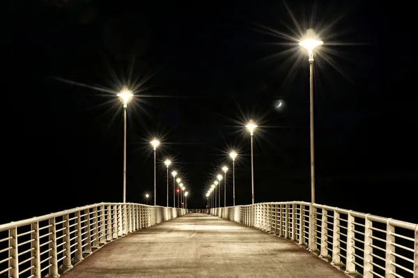 stock image Lamps Post on a pier at night