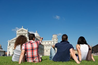 Four Friends on Vacation Visiting Pisa clipart