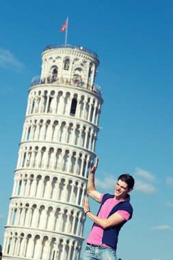 Young Man with Leaning Tower of Pisa clipart