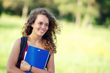 Young Female Student at Park clipart