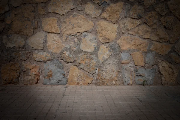 Текстура каменной стены с тёмными краями — стоковое фото