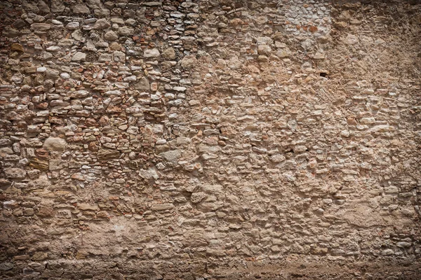 Очень старая текстура каменной стены с темными краями — стоковое фото