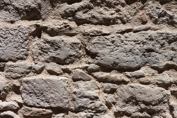 Closeup vintage grijze stenen muur achtergrond textuur — Stockfoto