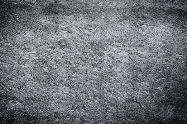 Dark edged black and white plaster concrete wall background. — Stock Photo, Image