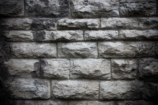 Пошкоджена текстура старовинної кам'яної стіни — стокове фото