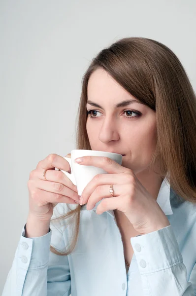 Stock image Girl with a cup of coffee drinkers