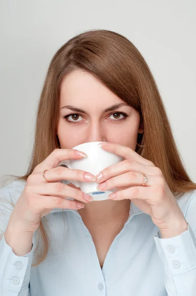 stock image Girl with a cup of coffee drinkers