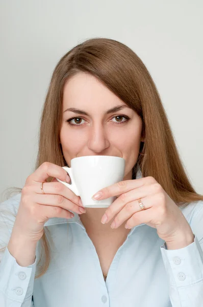 stock image Girl with a cup of coffee drinkers