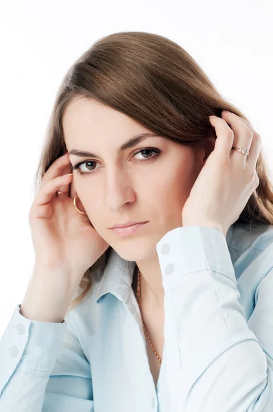 stock image The girl straightens her hair hands